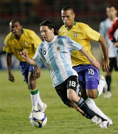 Brazil's Luis Fabiano tries to contain Argentina's Lionel Messi in a World Cup qualifier